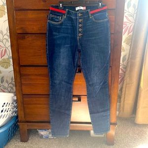 Hard to find, red and navy waisted Cabi button fly skinny jeans.